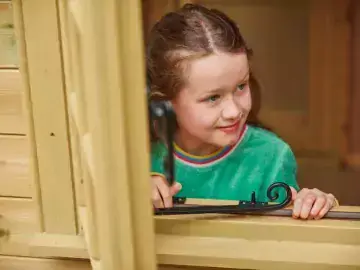 Young girl looking out of window