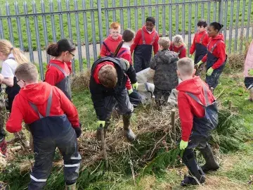 A class work together to create a habitat