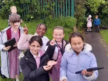 A group of pupils smiling with their findings