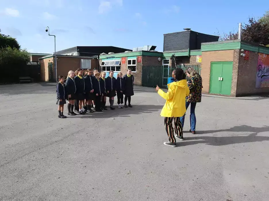 Pupils in a playground being interviewed