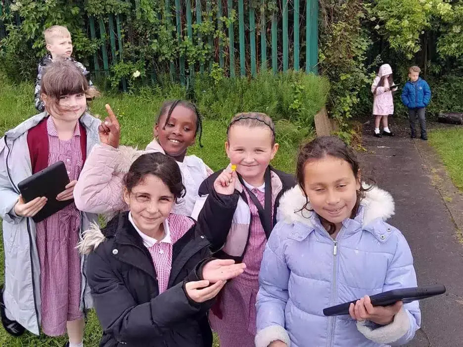 A group of pupils smiling with their findings