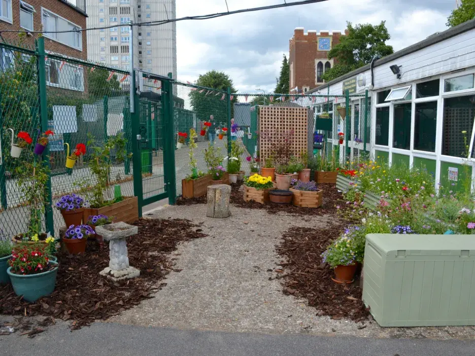 Planters on a concrete playground