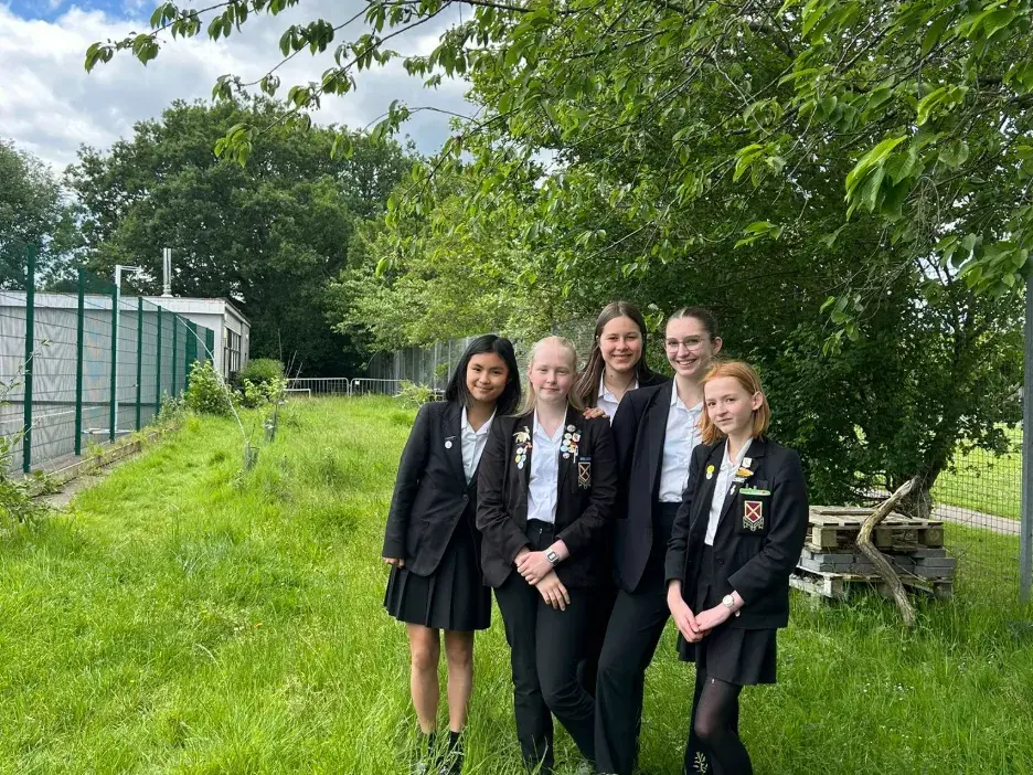 Pupils at Beaumont School standing in front of wildlife corridors