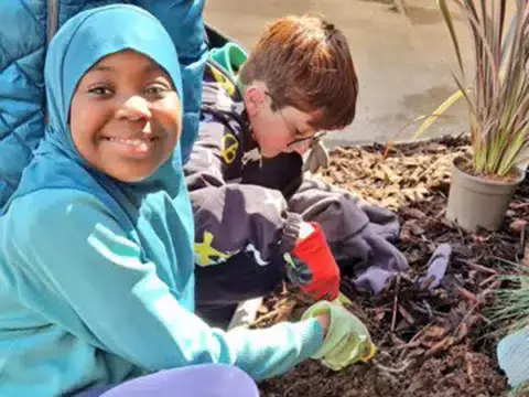 A smiling pupil in the garden