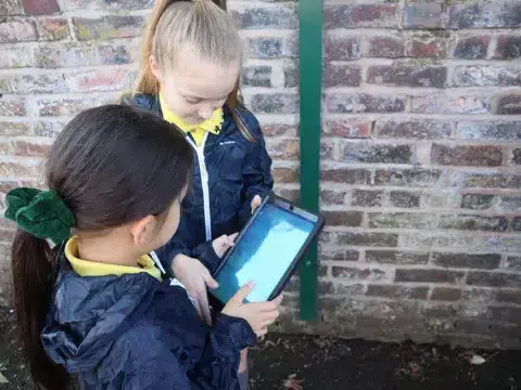 Two pupils using a tablet