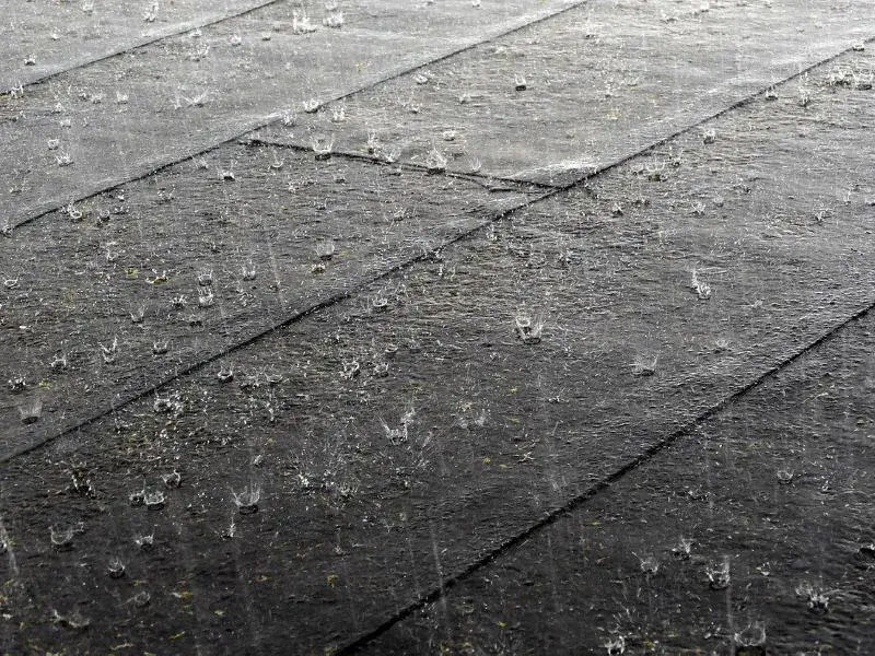 Heavy raindrops splashing on roof